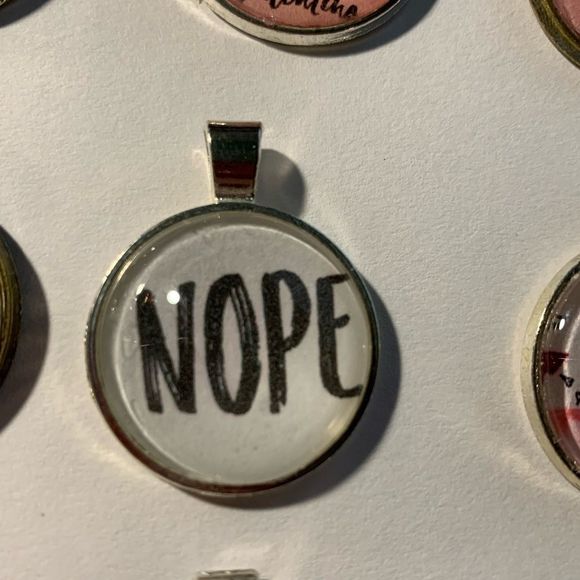 That’s a NOPE for me! silvertone pendant on vegan leather cord - Picture 2 of 2